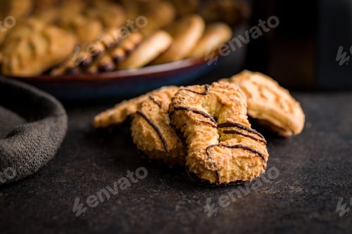 Preview: Assorted various cookies. Sweet biscuits on black table.