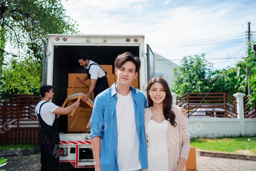 Preview: Asian Couple check while unloading boxes and furniture from a pickup truck