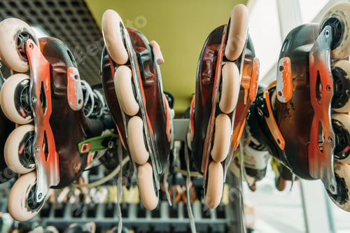 Preview: close up view of arranged roller skates in indoors skate park