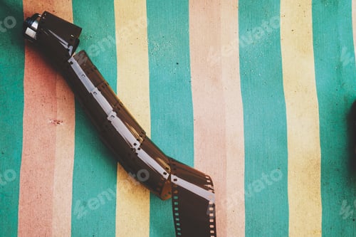 Preview: Old fim roll against a colorful background