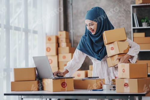 Preview: Small Startup Muslim Woman Checking parcels at work, freelancers, salespeople, checking production o