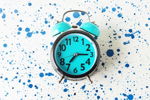 Preview: Turquoise alarm clock on abstract white and blue background. Flat lay.