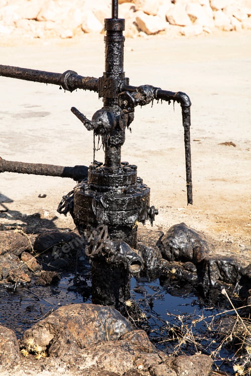 Preview: Oil drilling derricks at desert oilfield.