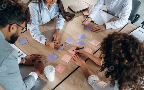 Preview: Brainstorming process. Office workers are by the table with paper stickers