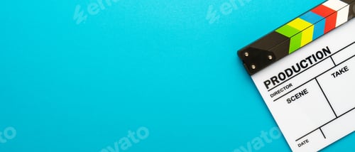 Preview: Top View Of White Clapperboard Over Turquoise Blue Background And Copy Space