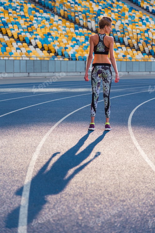 Preview: Fitness Trainer. Girl Doing Exercises At The Stadium