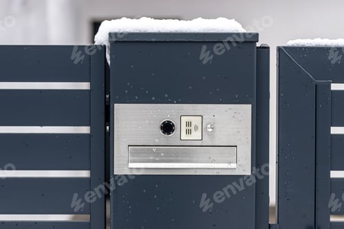 Preview: A modern videophone with a letterbox and a wireless card reader, mounted in panel fence.