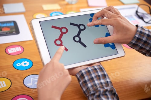 Preview: Crop hands browsing tablet over table