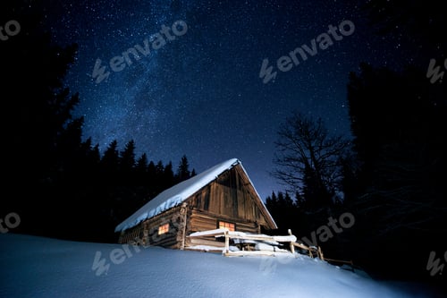 Preview: Beautiful wooden house in the winter forest under the stars