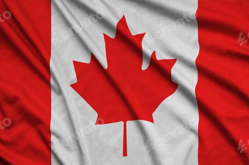 Preview: Canada flag is depicted on a sports cloth fabric with many folds. Sport team waving banner