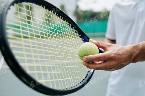 Preview: Tennis player serving ball