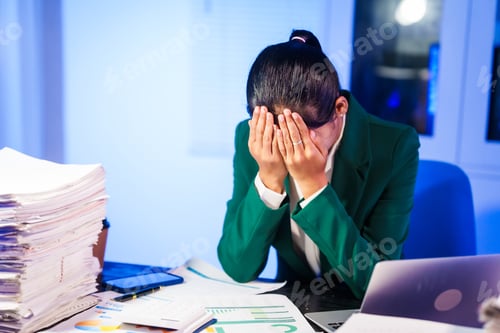 Preview: Asian business women often work late into the night, overwhelmed with stress, headaches, migraines