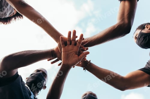 Preview: Group Of Friends Stacking Hands