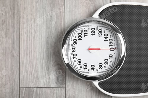 Preview: Modern scales on wooden floor, top view with space for text