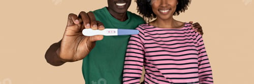 Preview: Glad millennial black couple show positive pregnancy test, isolated on beige background, studio