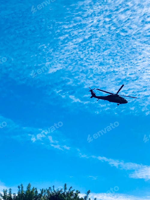 Preview: Helicopter flying overhead.
