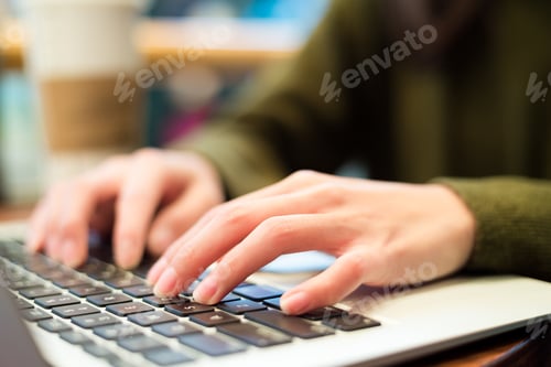 Preview: Woman working on laptop computer