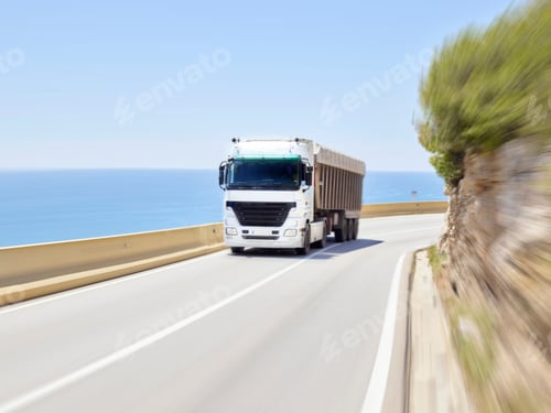 Preview: Truck driving along Jersey barrier of coastal highway, Sitges, Barcelona, Spain