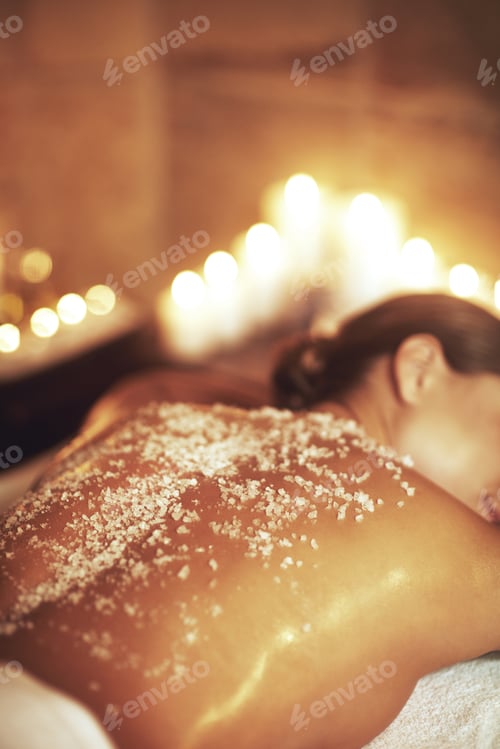 Preview: Cropped shot of a young woman getting an exfoliating treatment at the spa