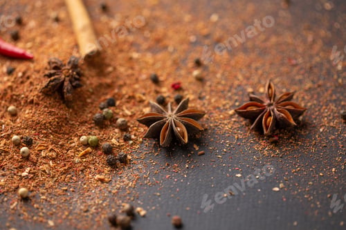 Preview: Close-up of star anise and cinnamon and ground pepper lie on the table. Spicy food concept and