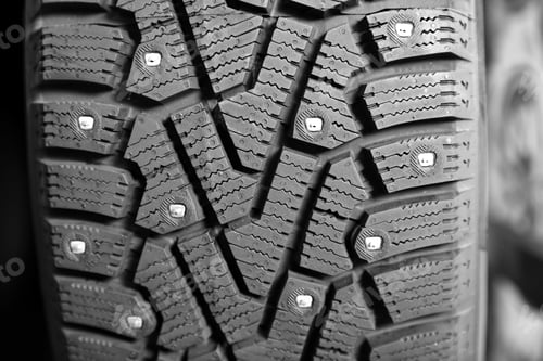 Preview: Car tire in auto store, closeup view