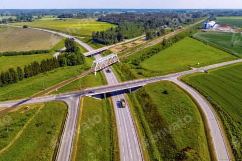 Preview: aerial top view of a multi-level highway and railroad crossing, Skulte, Latvia