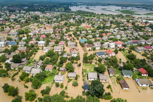 Preview: Aerial view of flooded houses with dirty water of Dnister river in Halych town, western Ukraine