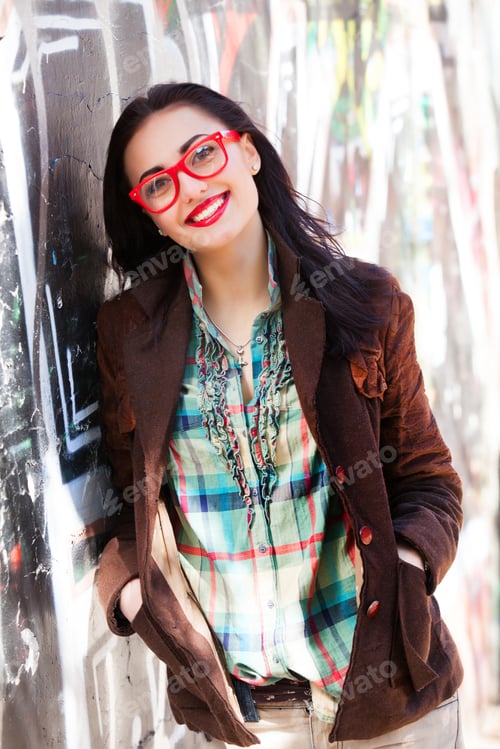 Preview: Teen girl near graffiti wall.