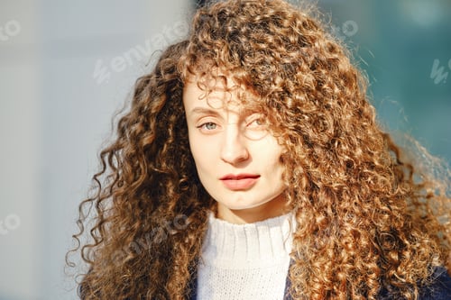 Preview: Portrait of a woman with brown curly hair