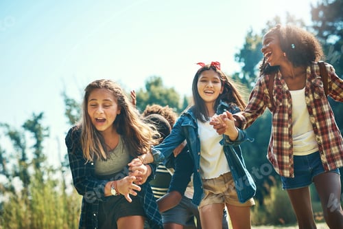 Preview: Hold onto your hats, summer camp is here. Shot of a group of teenagers having fun at summer camp.