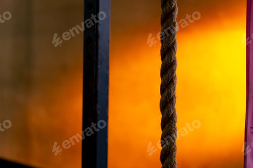 Preview: close-up of ropes for exercise in sports club on a bright orange background