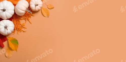 Preview: Autumn banner flat lay composition with pumpkins and fallen leaves and sweater with space for text.