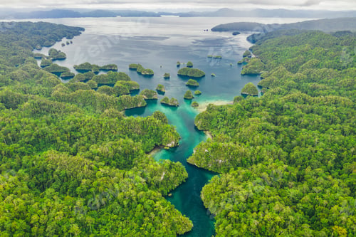 Preview: High angle shot of a little islets and islands in the middle of Indonesia