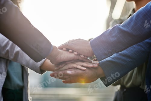 Preview: Shot of a group of business people with their hands stacked together