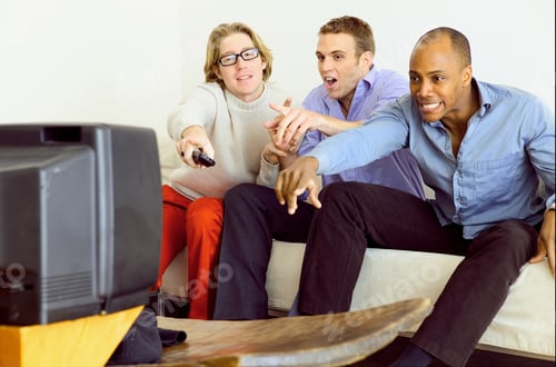 Preview: Friends watching television on sofa