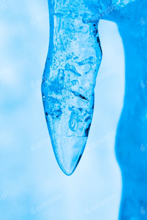 Preview: Vertical shot of a vibrant icicle with a blurry background