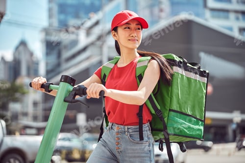 Preview: Young woman delivering food through city on sunny day