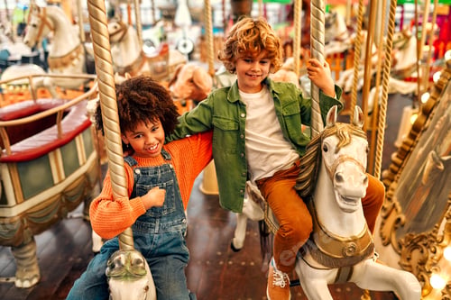 Preview: Kids having fun on a carnival Carousel