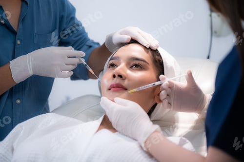 Preview: young Asian woman making cosmetology treatment skin injection, Mesotherapy of face beauty care