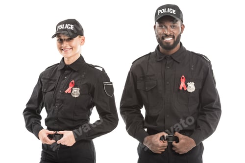 Preview: confident multiethnic police officers with aids awareness red ribbons looking at camera isolated on