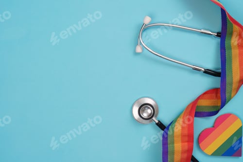 Preview: Stethoscope with LGBTQ pride ribbon on blue background