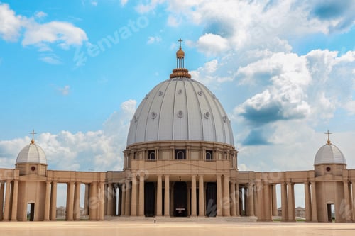 Preview: Basilica of Our Lady of Peace stands majestically in Yamoussoukro, Ivory Coast under a blue sky