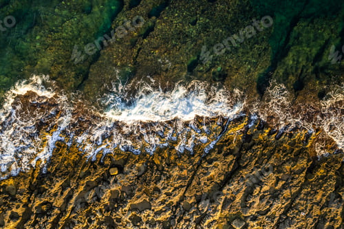 Preview: Ocean waves on the beach and turquoise water, drone view