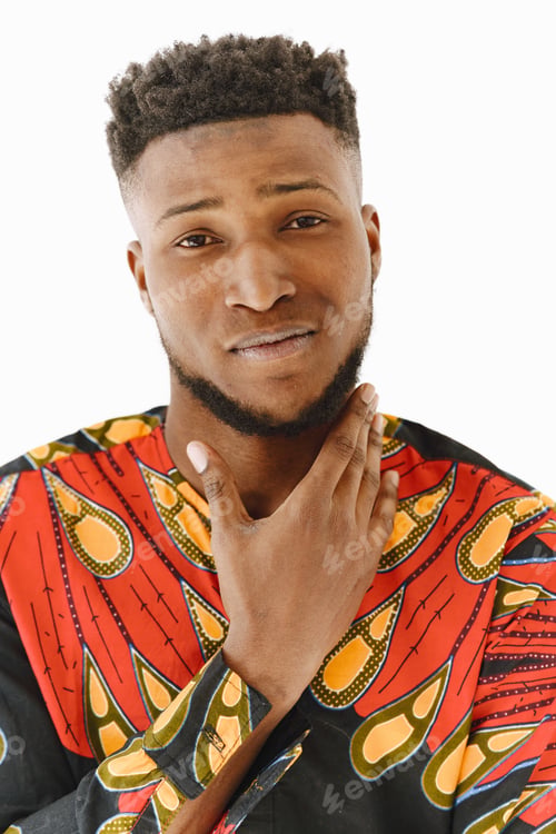 Preview: African young man posing against white wall