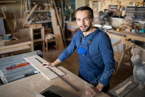Preview: Modern Carpenter Posing at Work