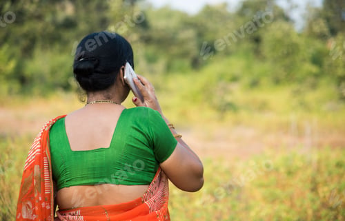 Preview: Indian woman talking on smartphone.