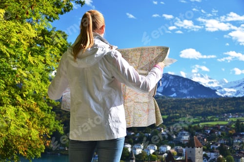 Preview: Girl Looking To The Map. Switzerland