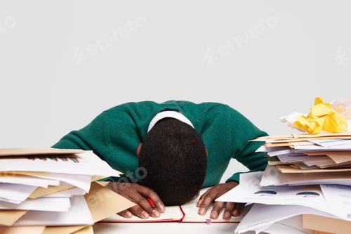 Preview: Stressful workaholic keeps head down on desk, feels tired and overworked, has much work, prepares fo