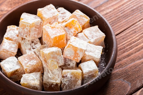 Preview: Turkish delight on a wooden table.