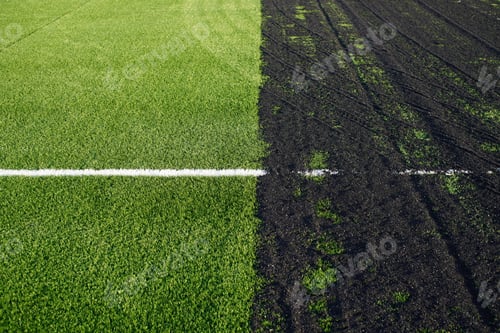 Preview: Making off an artificial grass soccer field with green synthetic grass surface and rubber granules
